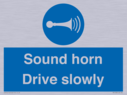 sound-horn-drive-slowly-warehousing-and-delivery-sign~